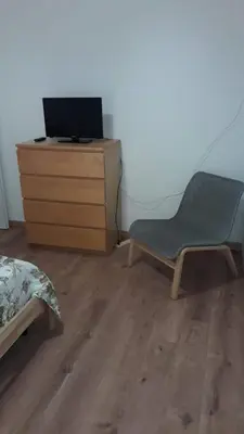 a bedroom with a bed and a desk with a chair at ISABEL Apartment in Rome
