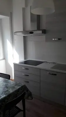 a kitchen with a sink and a counter top at ISABEL Apartment in Rome