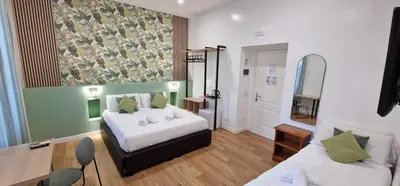 a bedroom with a large white bed and a window at Ciao Collection in Rome