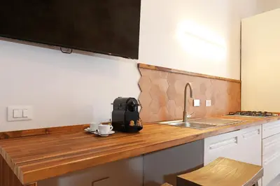 a kitchen counter with a sink and a microwave at Zelo Apartment by Nosdom Properties in Rome