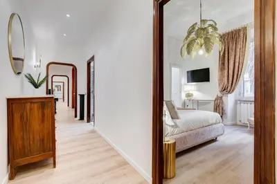a bedroom with a bed and a mirror at NEW Vatican BIG apartment - ROMEDREAMHOME in Rome