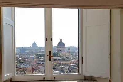 an open window with a view of a city at Appartamento 