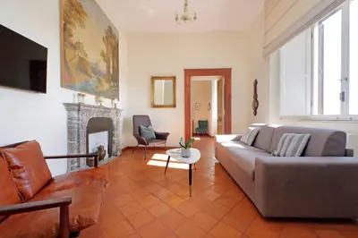 a living room with a couch and a fireplace at Appartamento 