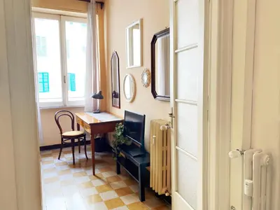 a room with a desk and a table and a window at Appartamento tipico Romano - Rione XXII Apartment in Rome