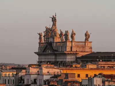 a large building with statues on top of it at ConTe Green House - 2 Apartments in Rome