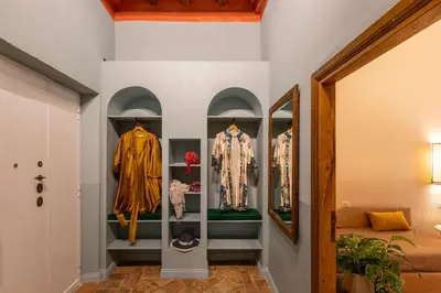 a display case in a room with clothes on display at ROMAC Baullari IV Large apartment in Campo de' Fiori in Rome
