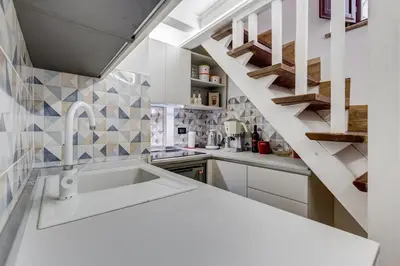 a kitchen with a sink and a staircase at Dream Home in Rome