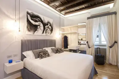 a bedroom with a large white bed in a room at Domus Libera in Rome