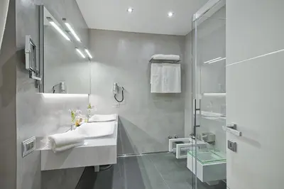 a bathroom with a sink and a mirror at Domus Libera in Rome