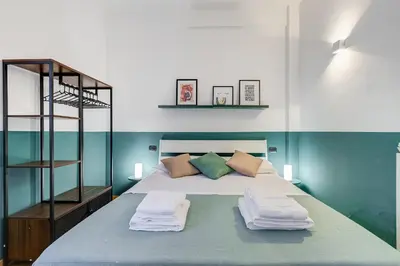 a bedroom with a bed with towels on it at Gaia's Place! in Rome