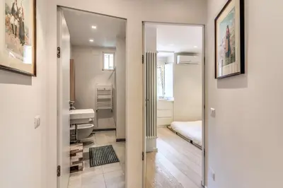 a bathroom with a sink and a mirror at Fresh House Fori Imperiali in Rome
