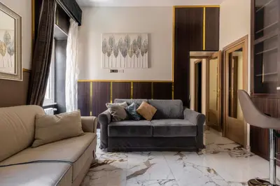 a living room with a couch and a table at Angie's Dream Home - Spanish Steps Rome in Rome