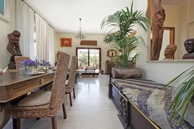 a living room with a table and chairs at Luxury Trastevere Terraces in Rome