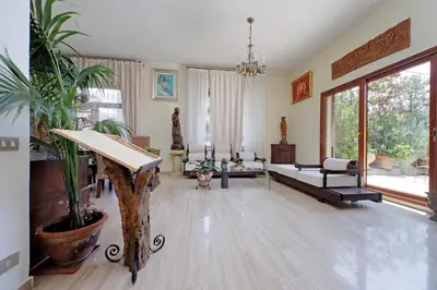 a living room with a couch and a table at Luxury Trastevere Terraces in Rome