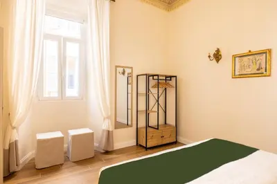 a bedroom with a bed and a window at Pantheon Apartments - Piccola Roma in Rome