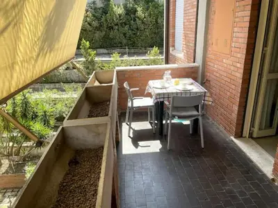 a small patio with a table and chairs on it at Apartment Roma San Pietro in Rome