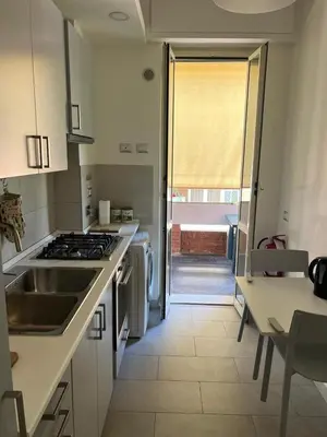 a kitchen with a sink and a stove top oven at Apartment Roma San Pietro in Rome