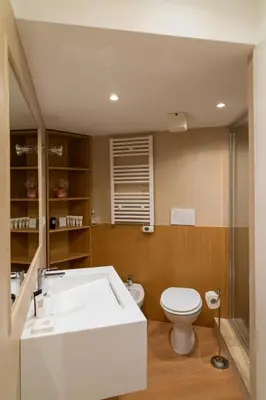 a bathroom with a toilet and a sink at Romantic Suite nel Cuore di Roma - Piazza Navona - in Rome