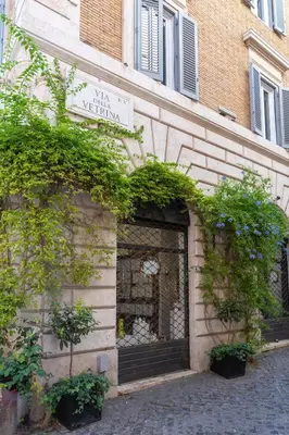 a building with a door with plants on it at Romantic Suite nel Cuore di Roma - Piazza Navona - in Rome