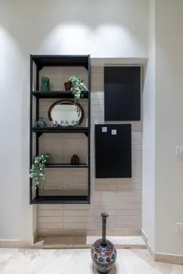 a vase sitting on a shelf in a room at Charming 3 Bedroom Apartment in the Historic Center in Rome