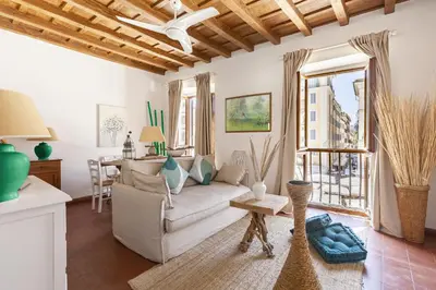 a living room with a couch and a table at Campo dei Fiori Luxury Gold in Rome