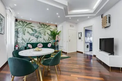 a living room with a table and chairs at Koma 7 Apartment in Rome