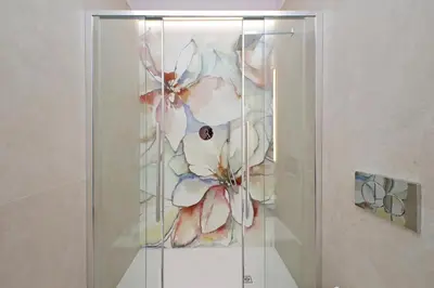 a glass display case with flowers in it at On Rome Affittacamere o GuestHouse in Rome