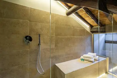 a bathroom with a shower with a glass door at iFlat Campo dei Fiori View and SPA in Rome