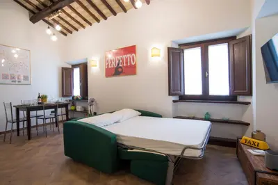 a hospital room with a bed and a table at Cacio e Pepe FLATS 1 & 2 in Rome