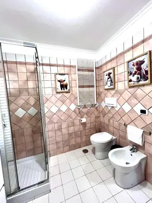 a bathroom with a toilet and a shower and a sink at Rome Is Home in Rome