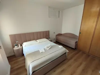 a bedroom with a bed with two towels on it at Charlie Up! in Rome