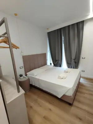 a bedroom with a bed with two towels on it at Charlie Up! in Rome