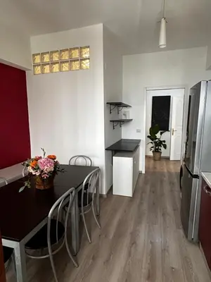 a kitchen and dining room with a table and chairs at Appartamento San Pietro Alla Cupola in Rome