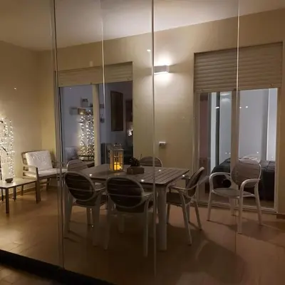 a dining room with a table and chairs at Monolocale nuova costruzione con giardino in Rome