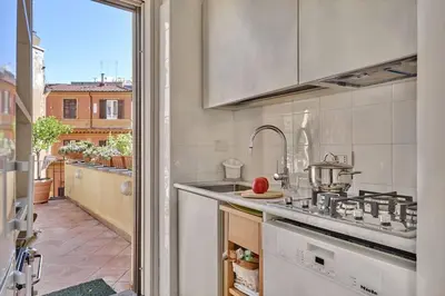 a kitchen with a sink and a stove at Panoramic Quirinal Penthouse in Rome