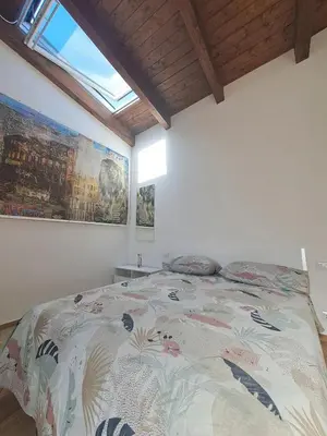 a bedroom with a bed in a room with a window at LUXURY Amazing Appia Antica - CELIO in Rome