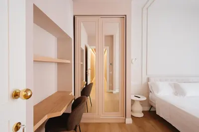 a bedroom with a desk and a bed and a door at Firenze Boutique Rooms in Rome