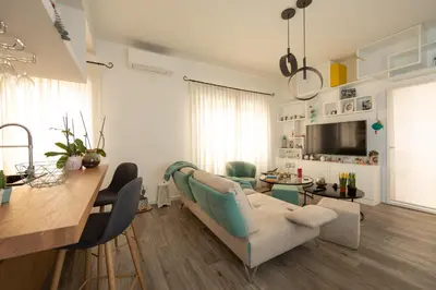 a living room with a couch and a table at La casa di Ele in Rome