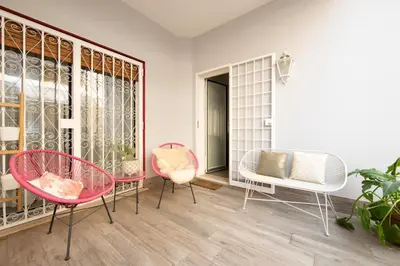 a room with two chairs and a table and chairs at La casa di Ele in Rome