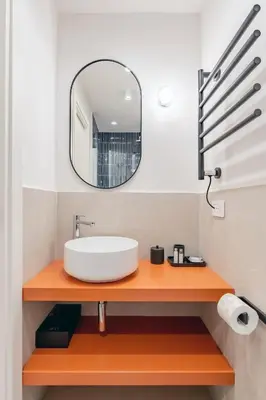 a bathroom with a sink and a mirror at UNICO Suite - GRUPPO BLAM in Rome
