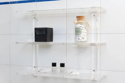 a shelf in a bathroom with a jar on it at Santa Margherita by Rental in Rome in Rome