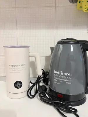 a toaster and a coffee pot on a kitchen counter at Lux Apartment Tuscolano in Rome