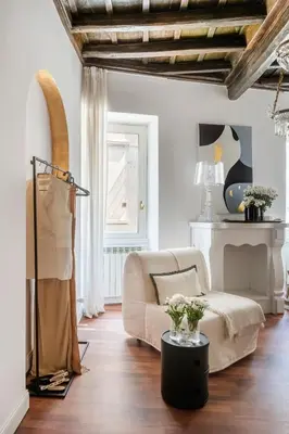 a living room with a couch and a table at JSuite in Rome