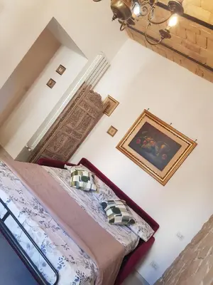 a bedroom with a bed and a picture on the wall at Testaccio Charme Apt in Rome