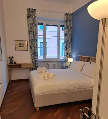a bedroom with a bed with two towels on it at Casa Lilli in Rome
