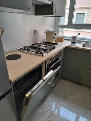 a kitchen with a stove and a counter top at Casa Lilli in Rome