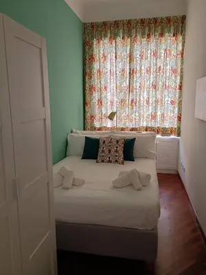 a bedroom with a large bed with a window at Casa Lilli in Rome