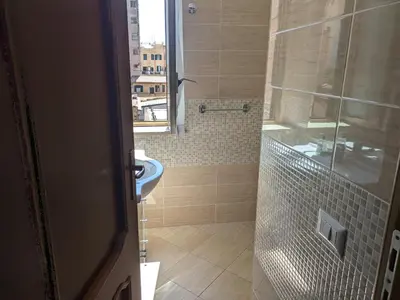 a bathroom with a toilet and a sink and a shower at Torpigna house in Rome