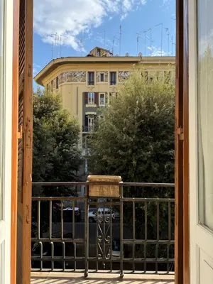 a balcony with a view of a building at Domus Urbani in Rome