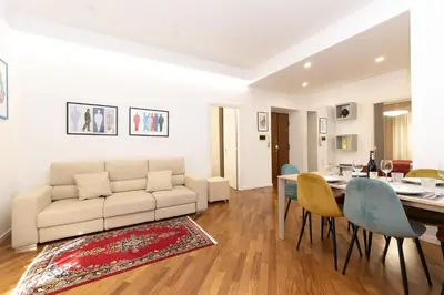 a living room with a couch and a table at Barca House in Rome